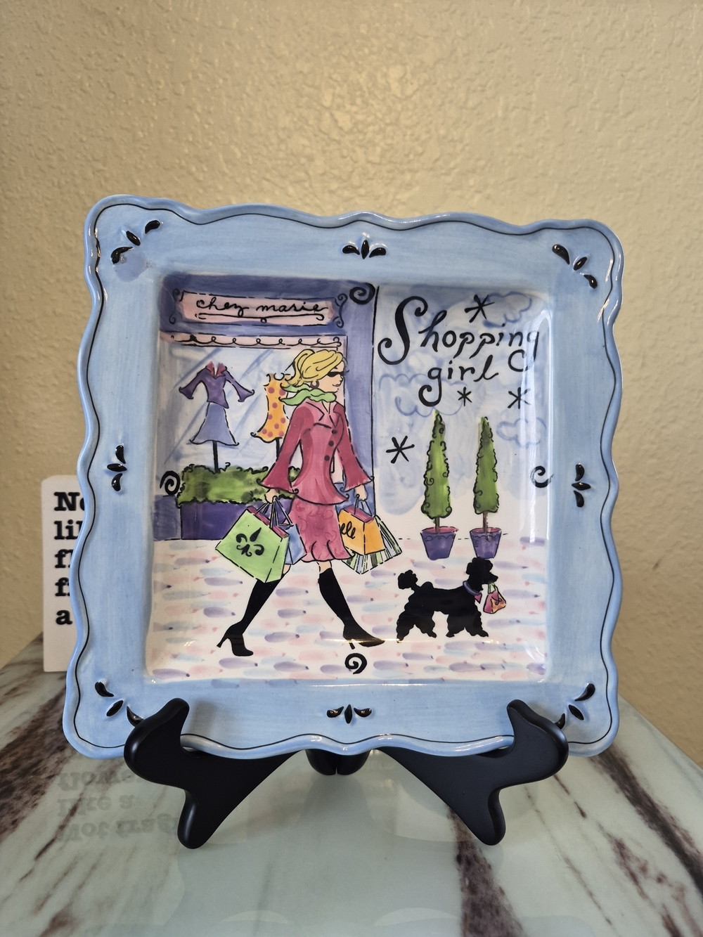 Certified International Shopping Girl Decorative Plate in Light Blue.